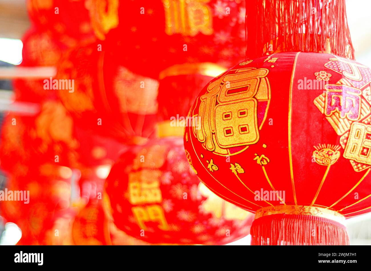 The traditional Chinese red lanterns hanging in front of people’s house ...