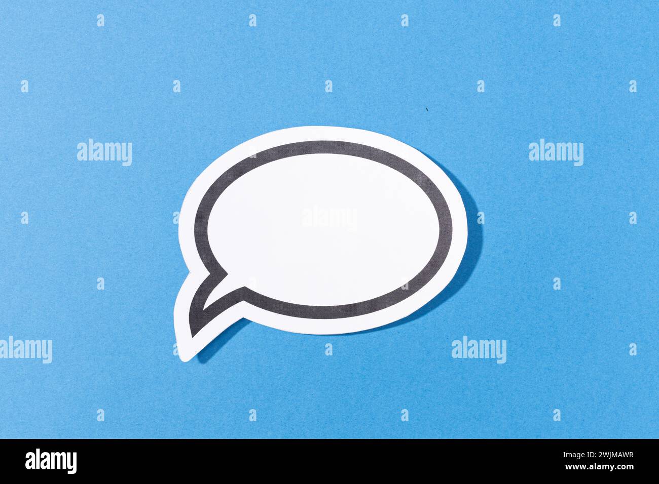 Blank Speech Bubble isolated on blue background. Mock up template Stock Photo