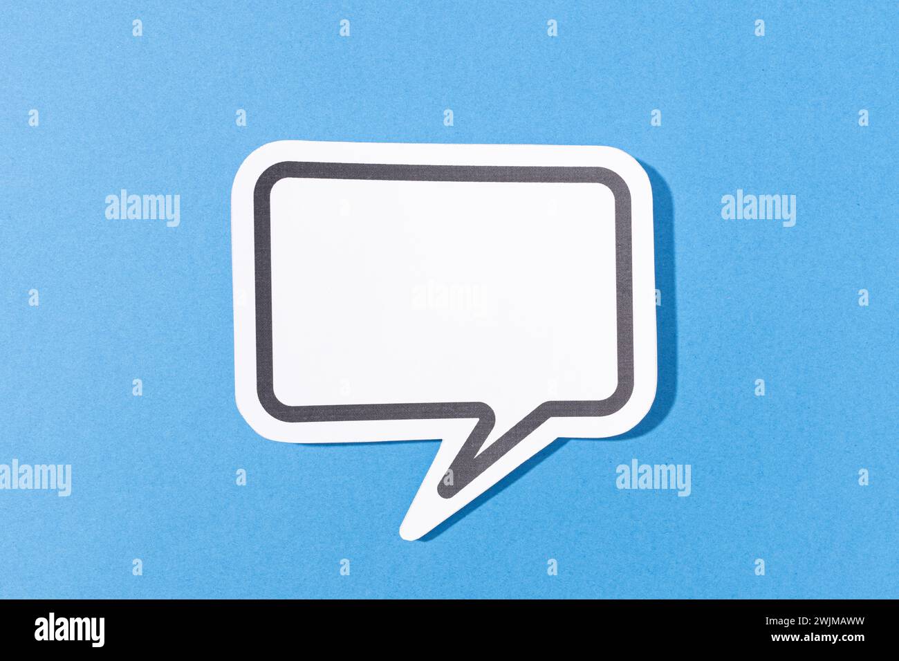 Blank Speech Bubble isolated on blue background. Mock up template Stock Photo