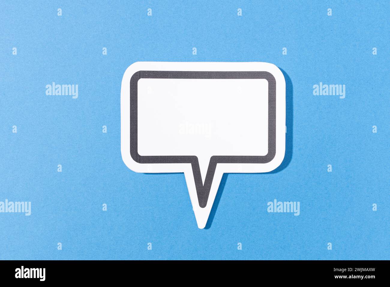 Blank Speech Bubble isolated on blue background. Mock up template Stock Photo