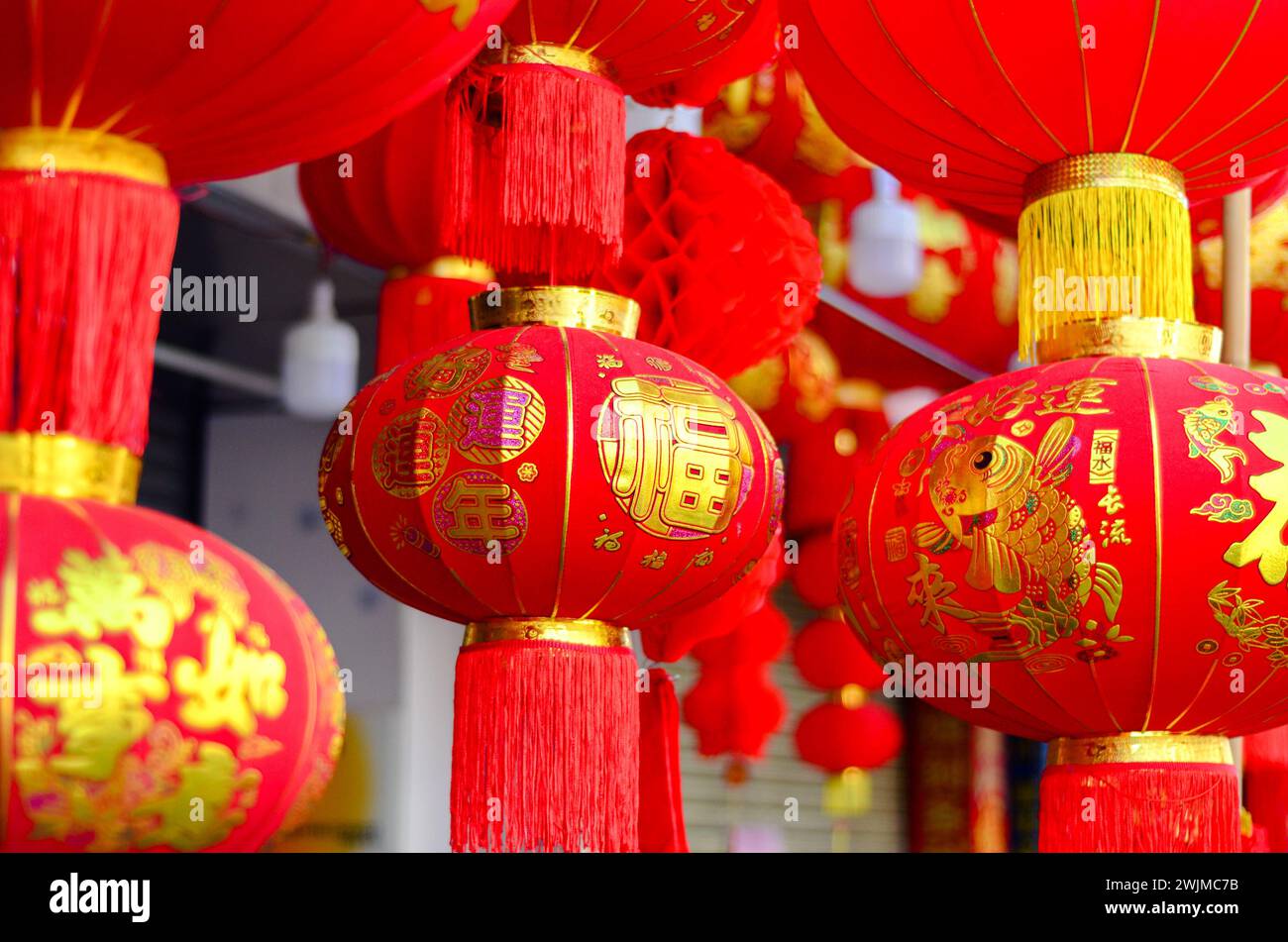The traditional Chinese red lanterns hanging in front of people’s house ...