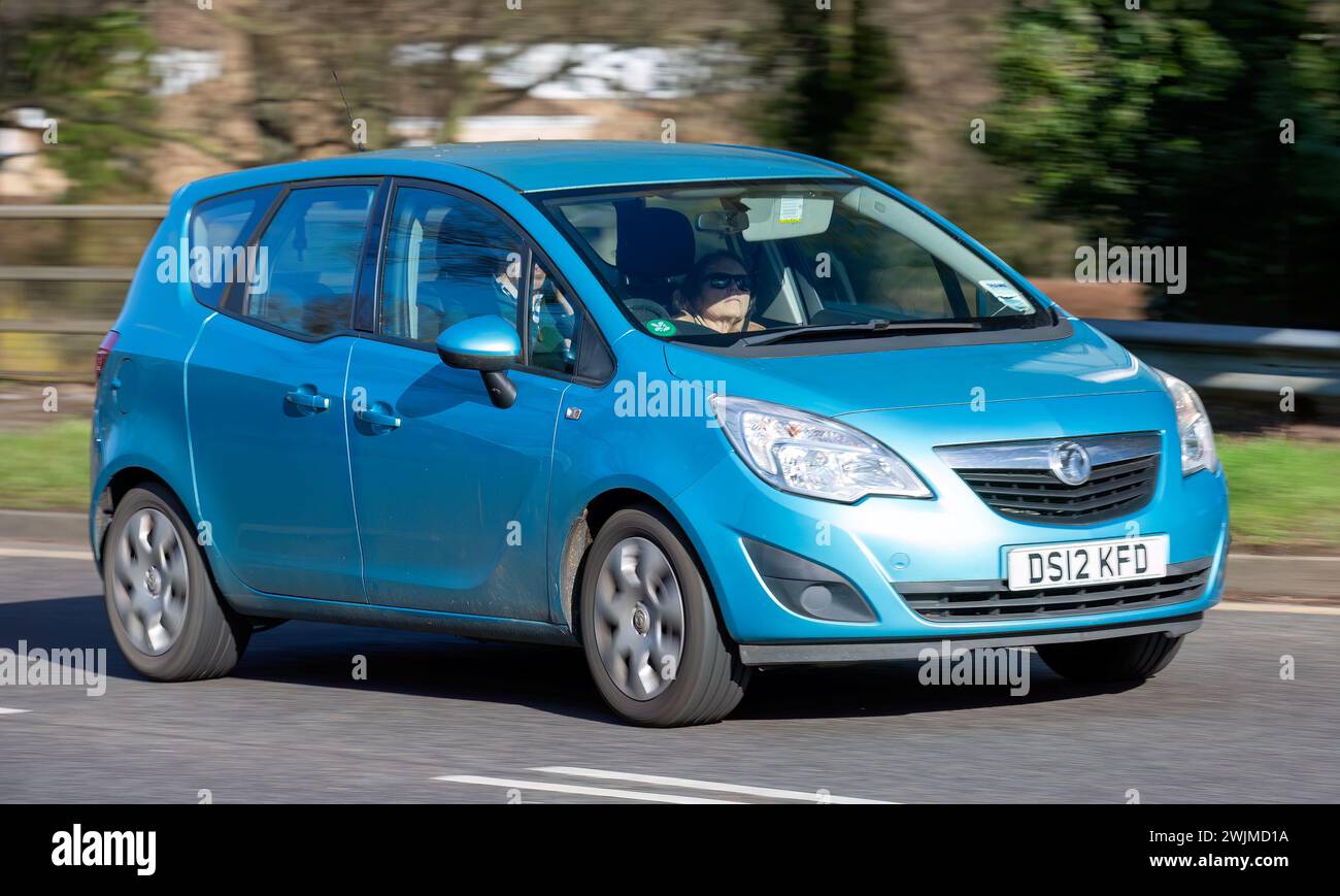 Milton Keynes,UK-Feb 13th 2024: 2012 blue Vauxhall Meriva car  driving on an English road Stock Photo