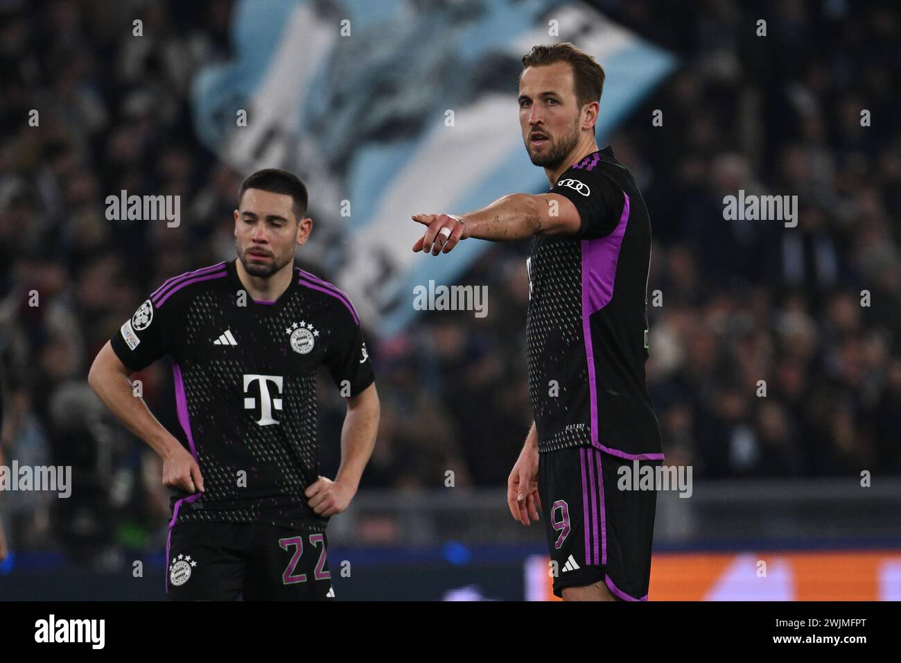 Rome, Italy. 14th Feb, 2024. Raphael Guerreiro and Harry Kane of F.C. Bayern Munchen during the round of 16 of the UEFA Champions League between S.S. Lazio vs F.C. Bayern Munich on 14 February 2024 at the Olympic Stadium in Rome, Italy. Credit: Independent Photo Agency/Alamy Live News Stock Photo