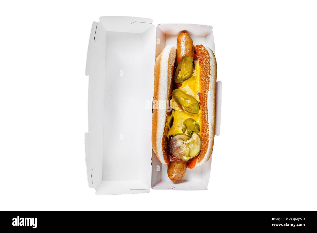 Hot dog with jalapeno in a cardboard box, food delivery concept. Junk food. Isolated on white background. Top view Stock Photo