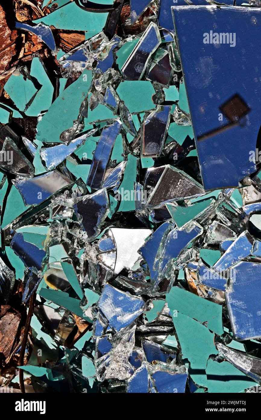 Broken mirror thrown in vacant lot Stock Photo