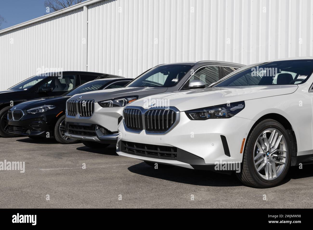 Indianapolis - February 11, 2024: BMW dealership. BMW offers cars and SUVs in full gas, full battery electric, hybrid and mild hybrid engines. Stock Photo
