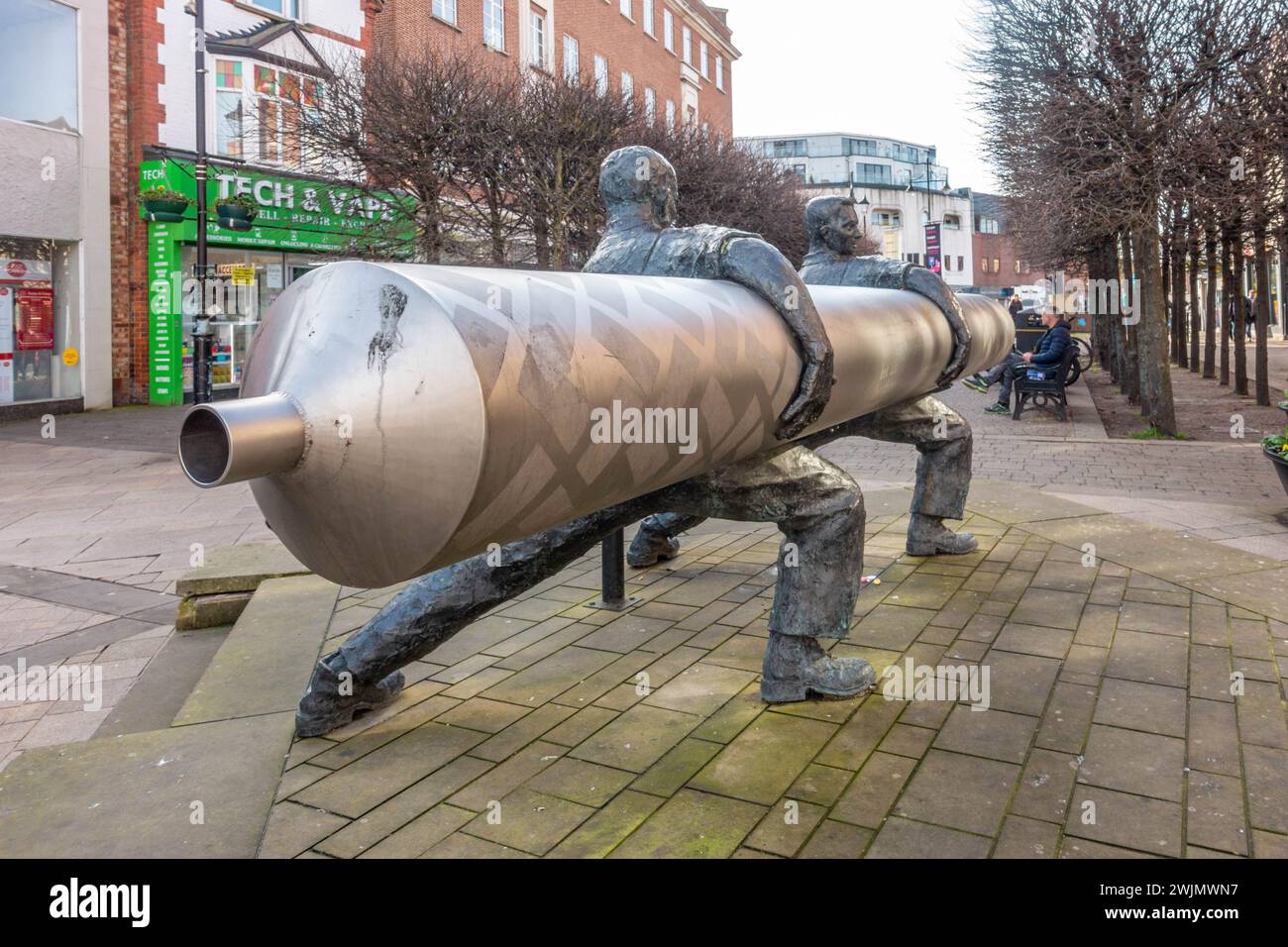 'Roll out the Lino' is a sculpture by David Annand and stand in The High Street in Staines-upon-Thames in Surrey, UK Stock Photo