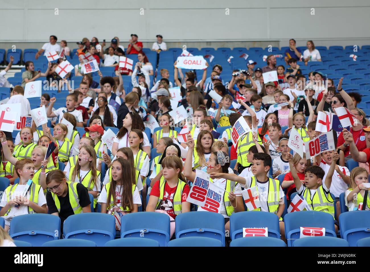 Group of young fans in hi-vis bibs England v Norway UEFA Womens Euro Brighton Community Stadium (Amex Stadium) 11 July 2022 Stock Photo