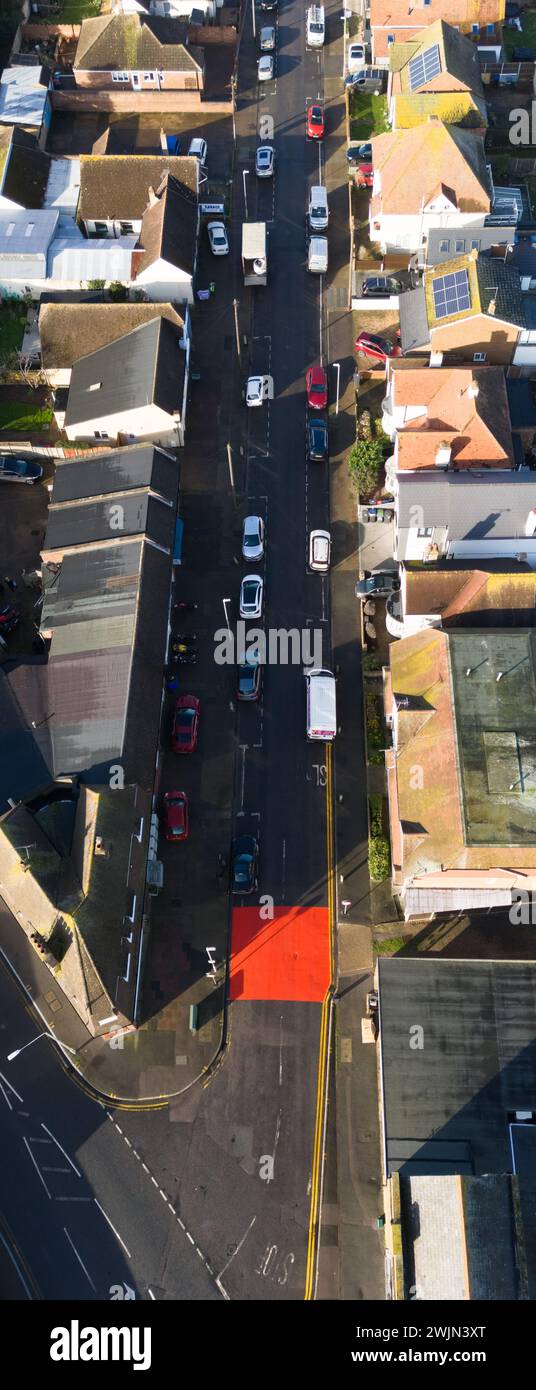 Herne Bay, Kent, UK. 16th Feb, 2024. Aerial imagery shows 'dazzling' new road markings to indicate new speed restriction zones which have angered residents calling them 'over the top' and 'lurid'.  Pic: Drone shot of junction between The Broadway and Sea Street. Credit: Jamie McBean/Alamy Live News Stock Photo