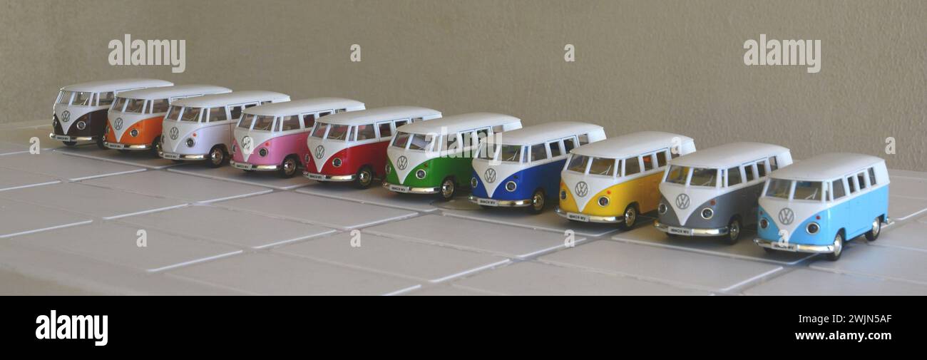Van. Diecast, Iron miniature of vans of various colors, Brazil, South America, side view, selective focus on white table on white background, intentio Stock Photo