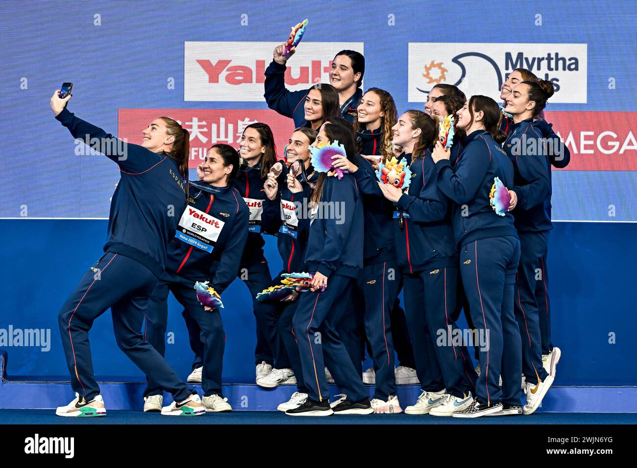 Doha, Qatar. 16th Feb, 2024. Athletes of Team Spain celebrate the 3rd place with a bronze medal after the water polo women 3rd/4th place match between team Spain (white caps) and team Greece (blue caps) during the 21st World Aquatics Championships at the Aspire Dome in Doha (Qatar), February 16, 2024. Credit: Insidefoto di andrea staccioli/Alamy Live News Stock Photo