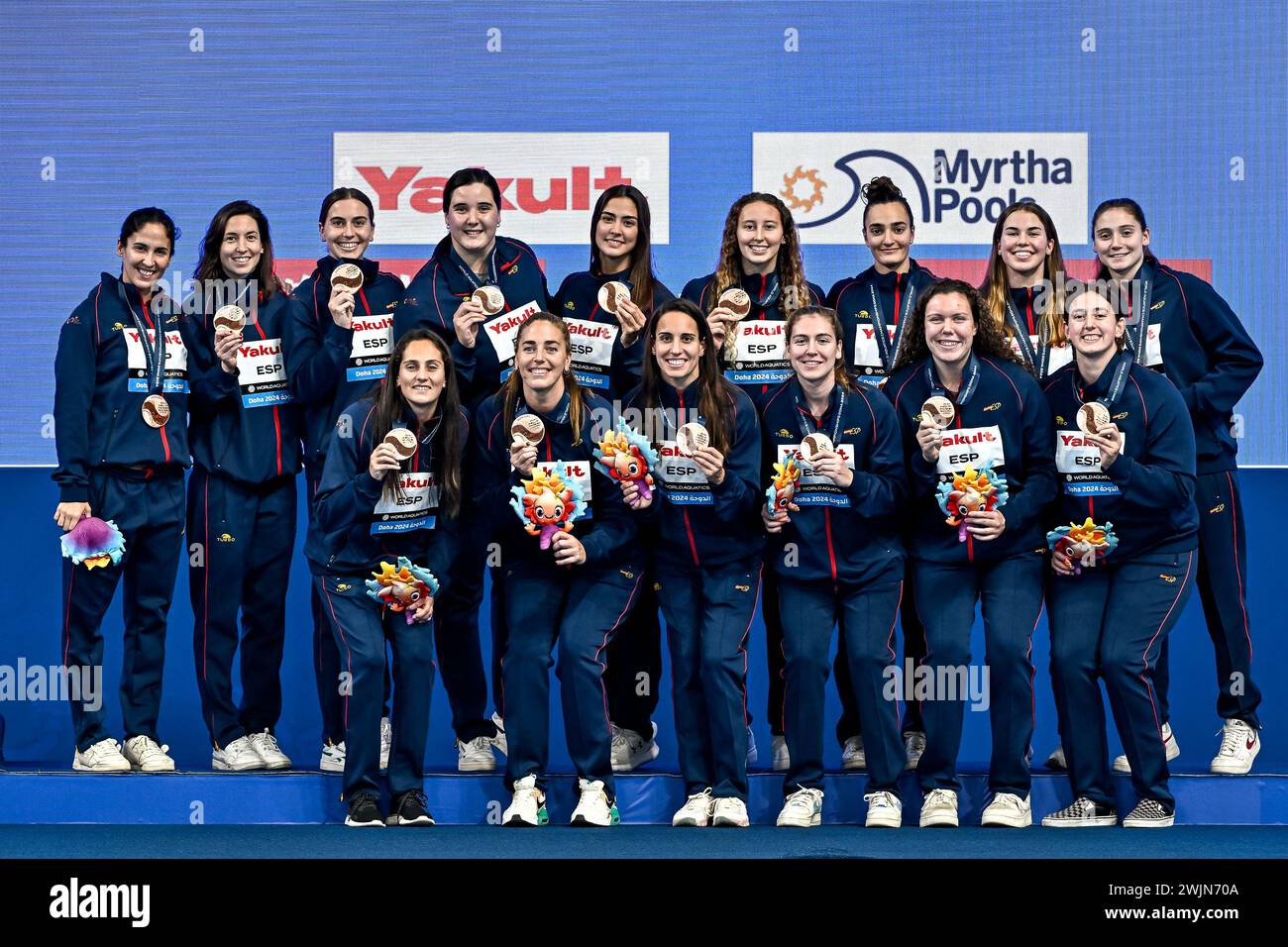 Doha, Qatar. 16th Feb, 2024. Athletes of Team Spain celebrate the 3rd place with a bronze medal after the water polo women 3rd/4th place match between team Spain (white caps) and team Greece (blue caps) during the 21st World Aquatics Championships at the Aspire Dome in Doha (Qatar), February 16, 2024. Credit: Insidefoto di andrea staccioli/Alamy Live News Stock Photo