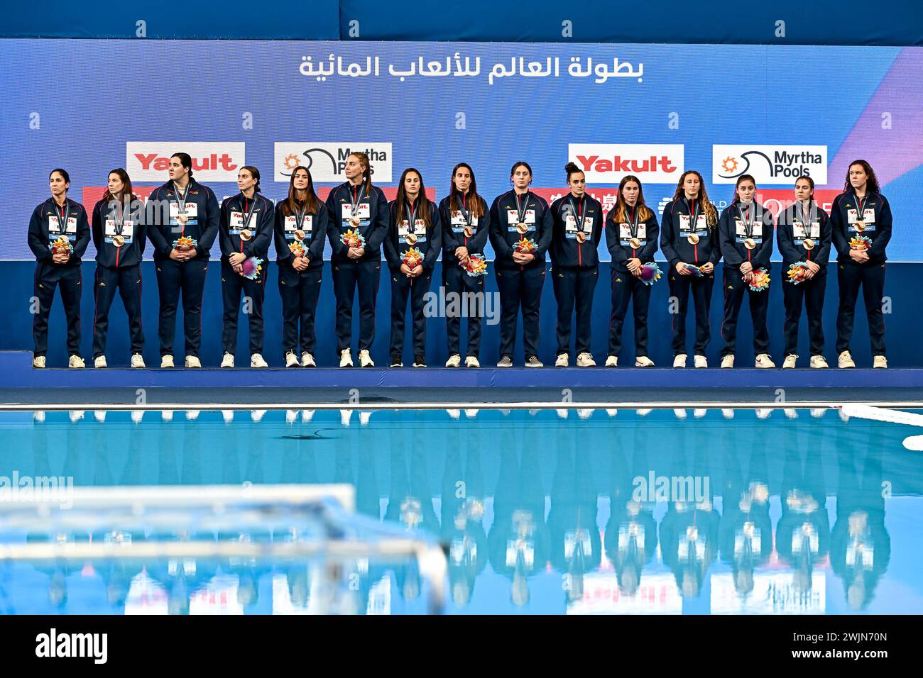Doha, Qatar. 16th Feb, 2024. Athletes of Team Spain celebrate the 3rd place with a bronze medal after the water polo women 3rd/4th place match between team Spain (white caps) and team Greece (blue caps) during the 21st World Aquatics Championships at the Aspire Dome in Doha (Qatar), February 16, 2024. Credit: Insidefoto di andrea staccioli/Alamy Live News Stock Photo