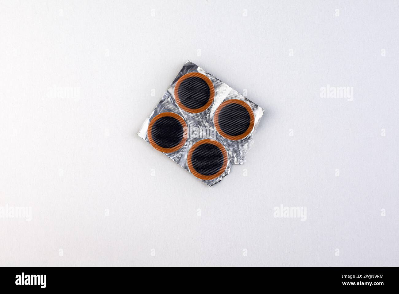 Bicycle puncture repair kit on a white Stock Photo