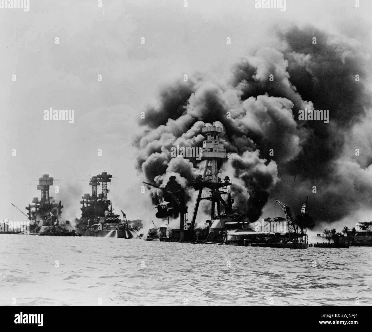 Hawaii, Pearl Harbor attack, Dec 7, 1941 - Left to right U.S.S. West Virginia, severely damaged; U.S.S. Tennessee, damaged; and U.S.S. Arizona, sunk Stock Photo
