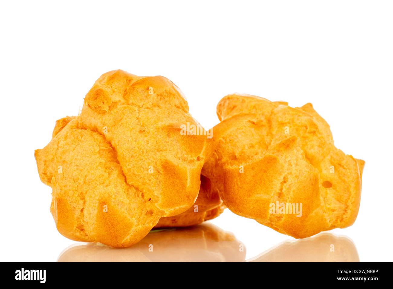 Three delicious eclairs, macro, isolated on white background. Stock Photo
