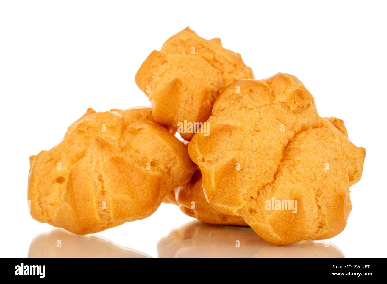 Three delicious eclairs, macro, isolated on white background. Stock Photo