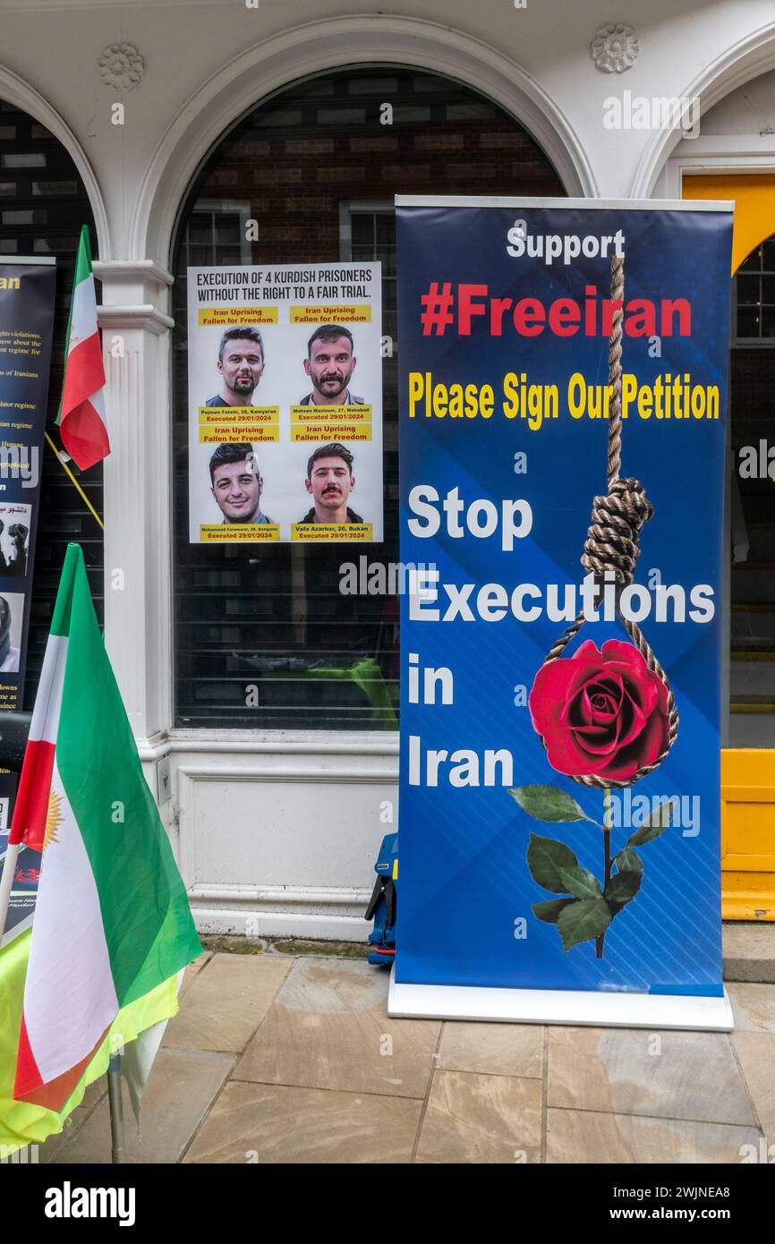 16th February 2024. A small Free Iran protest took place today on Winchester High Street, Hampshire, England, UK. The protesters were collecting signatures from people supporting their cause to Stop Executions in Iran. Stock Photo