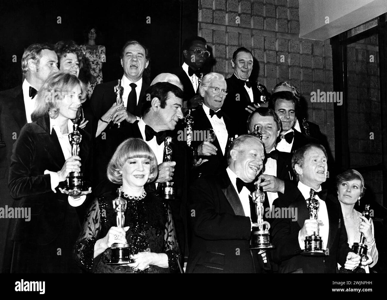 Past Oscar Winners in December 1975 at the opening of new building for the Academy of Motion Picture Arts and Sciences in Los Angeles with from left top row JACK LEMMON SHELLEY WINTERS KARL MALDEN SIDNEY POITIER and BEN JOHNSON middle row EVA MARIE SAINT WALTER MATTHAU GINGER ROGERS (obscured) LAURENCE OLIVIER ROD STEIGER MAXIMILIAN SCHELL and PETER USTINOV (obscured) front row CLAIRE TREVOR HAROLD RUSSELL RED BUTTONS and JOANNE WOODWARD Stock Photo