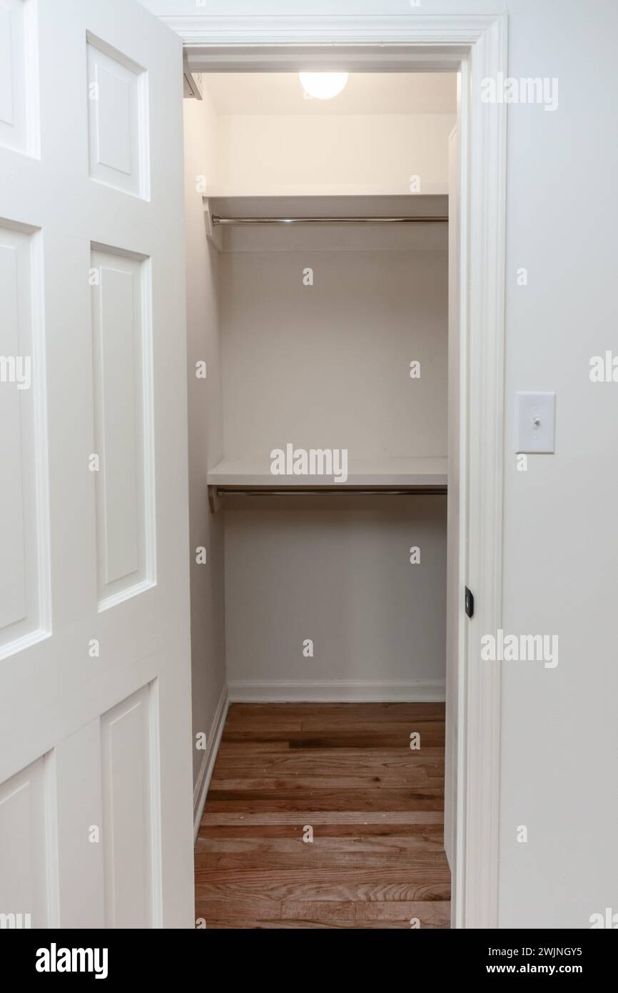Interior white solid wood closet with wood shelves Stock Photo - Alamy