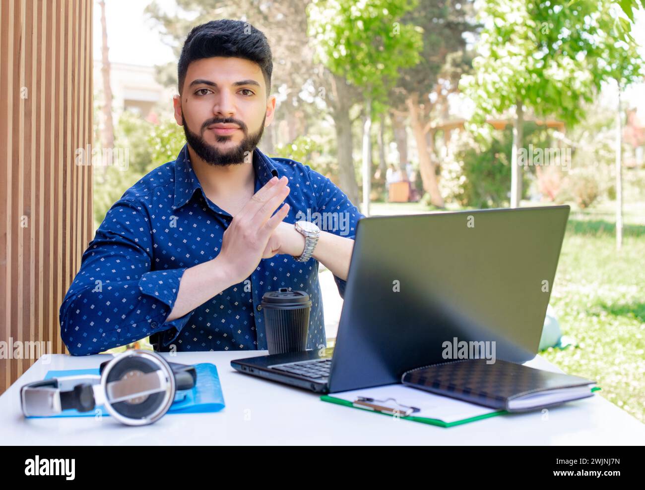 Stylish young businessman working outdoors. Stock Photo