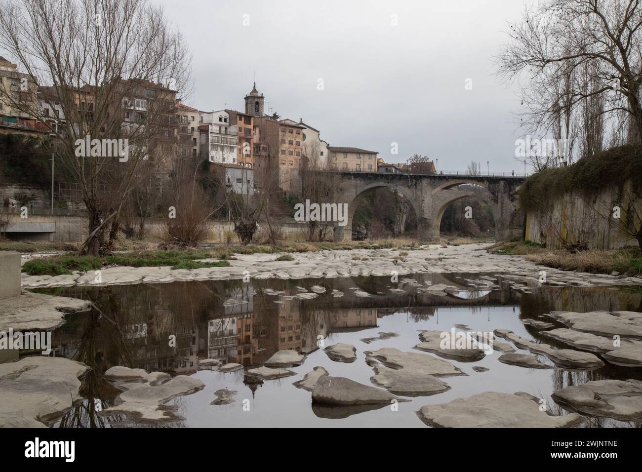 Stone bridge over water near buildings Stock Photo - Alamy