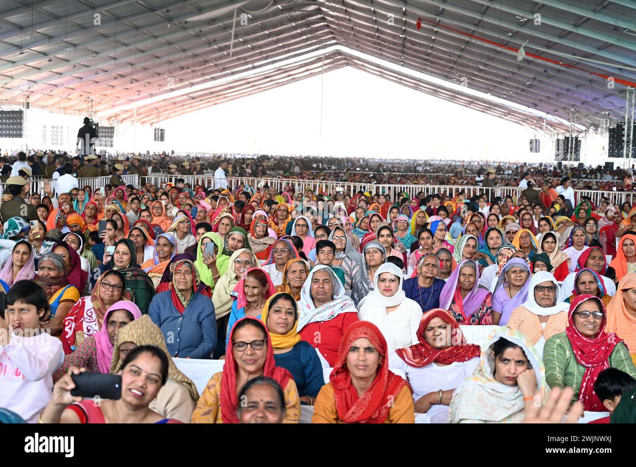 Rewari, India. 16th Feb, 2024. REWARI, INDIA - FEBRUARY 16: Thousands of people arrives to listen Prime Minister Narendra Modi speech during the inaugurates lays foundation stone of country's 22nd All India Institute Of Medical Sciences(AIIMS) and other projects at Majra Bhalkhi on February 16, 2024 in Rewari, India.(Photo by Parveen Kumar/Hindustan Times/Sipa USA) Credit: Sipa USA/Alamy Live News Stock Photo