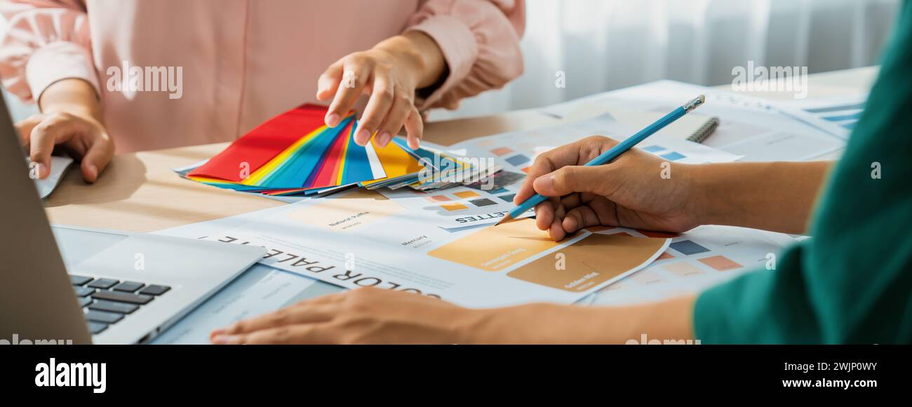 Cropped imaged of professional interior designers choose appropriate ...