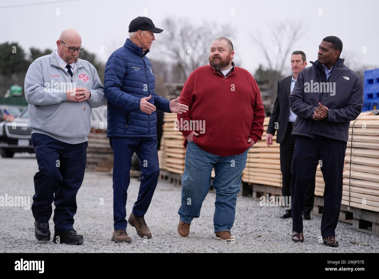 President Joe Biden talks with East Palestine Mayor Trent Conaway as
