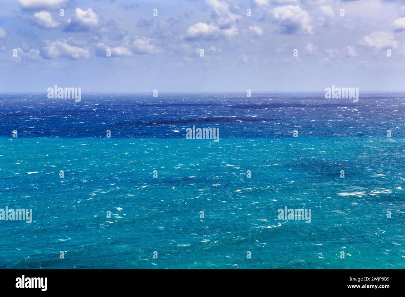 View of turquoise sea, horizon, coastline at La Isleta, sunny weather
