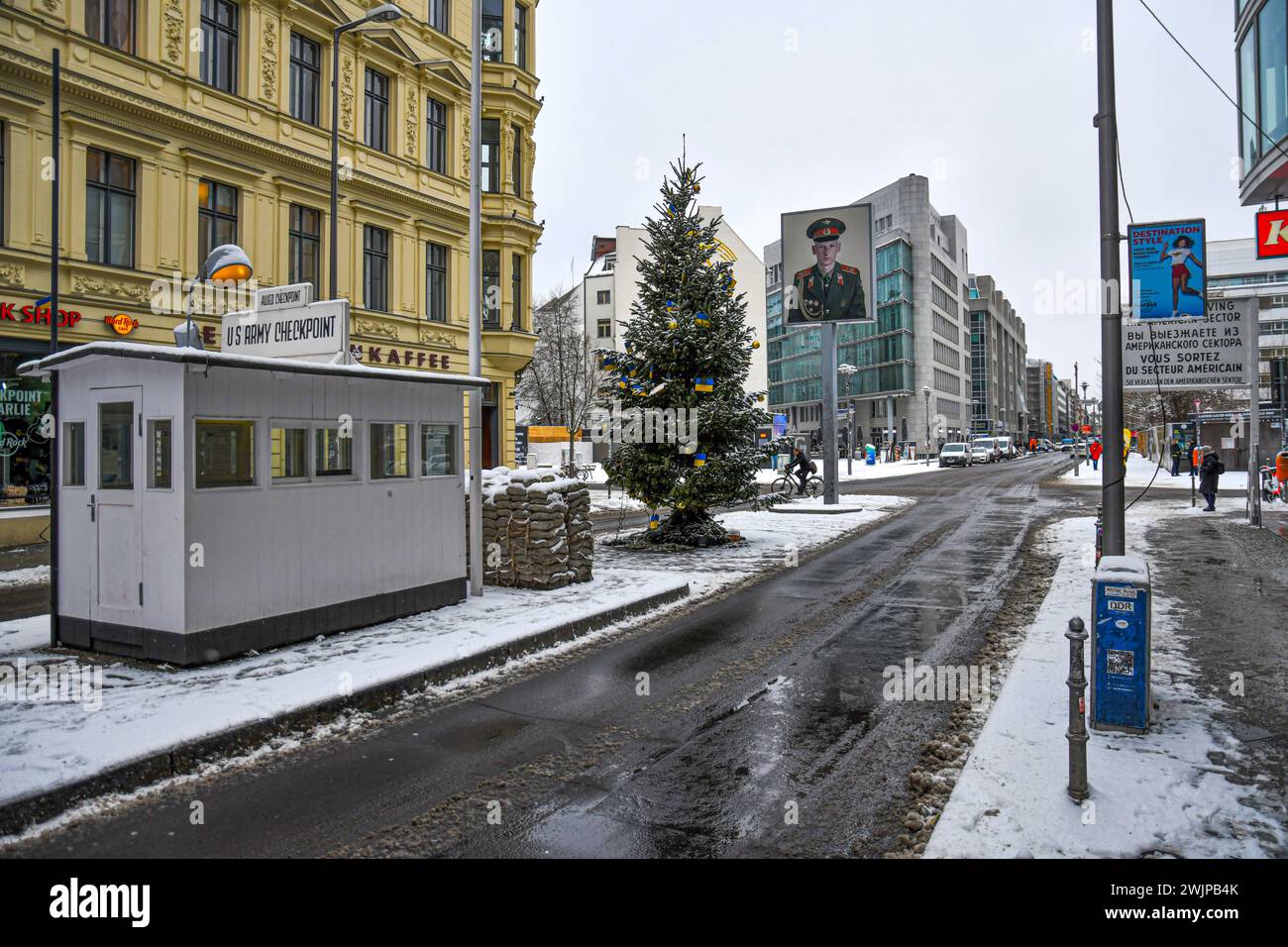 Berlin,Germany.01-15-2024.Streets of Berlin in wintertime with snow.Checkpoint Charlie Stock Photo