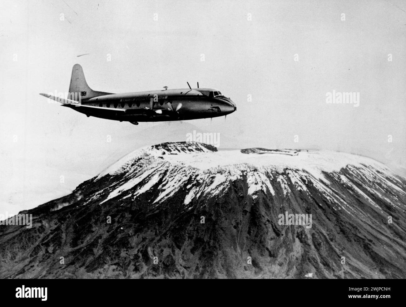 Altitude Test First turbo-prop airliner to fly in Africa, the Vickers Viscount, undergoes high altitude trails over Mount Kilimanjaro, East Africa. This picture was taken from another aircraft. June 27, 1950. (Photo by Fox Photos). Stock Photo