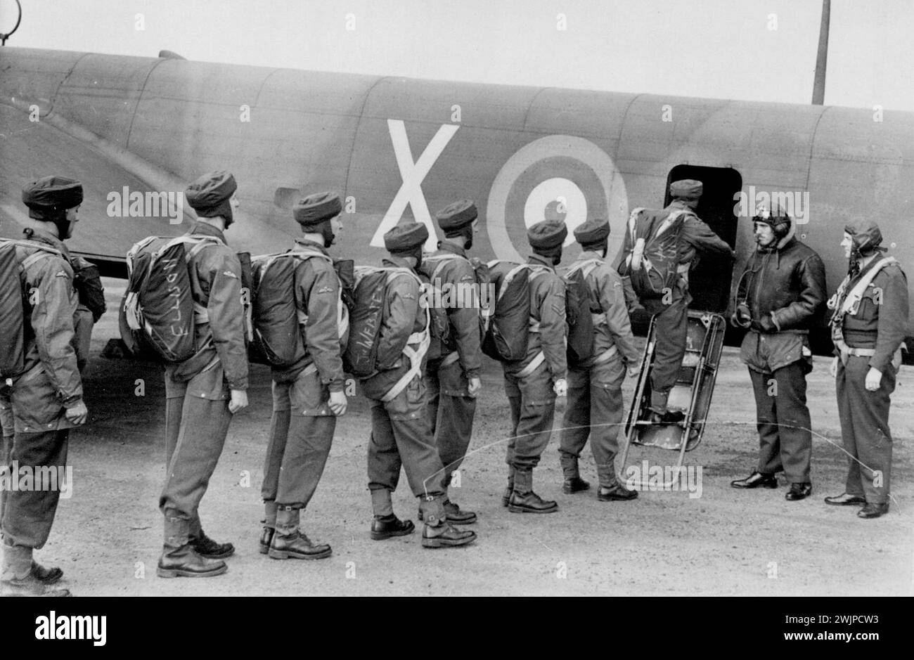 Britain's Paratroops in Training -- Paratroops emplaning in Whitley aircraft. These Pictured taken at an R.A.F. Station where parachute troops are in training show the varied activities of members of Britain's newest 'Army' who are in training for the important part they will have to play when Britain takes the offensive on land. October 23, 1941. (Photo by Planet News Ltd.). Stock Photo