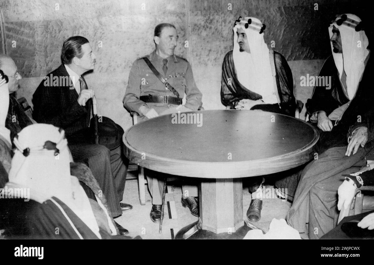 End Of The Voyage - On board the Quean Mary - Lord Mottistone, who greeted the distinguished Arab visitors, is seen in conversation with the Emir Feisul (on his left), the heir to King Ibn Saud of Saudi Arabia. August 11, 1945. Stock Photo