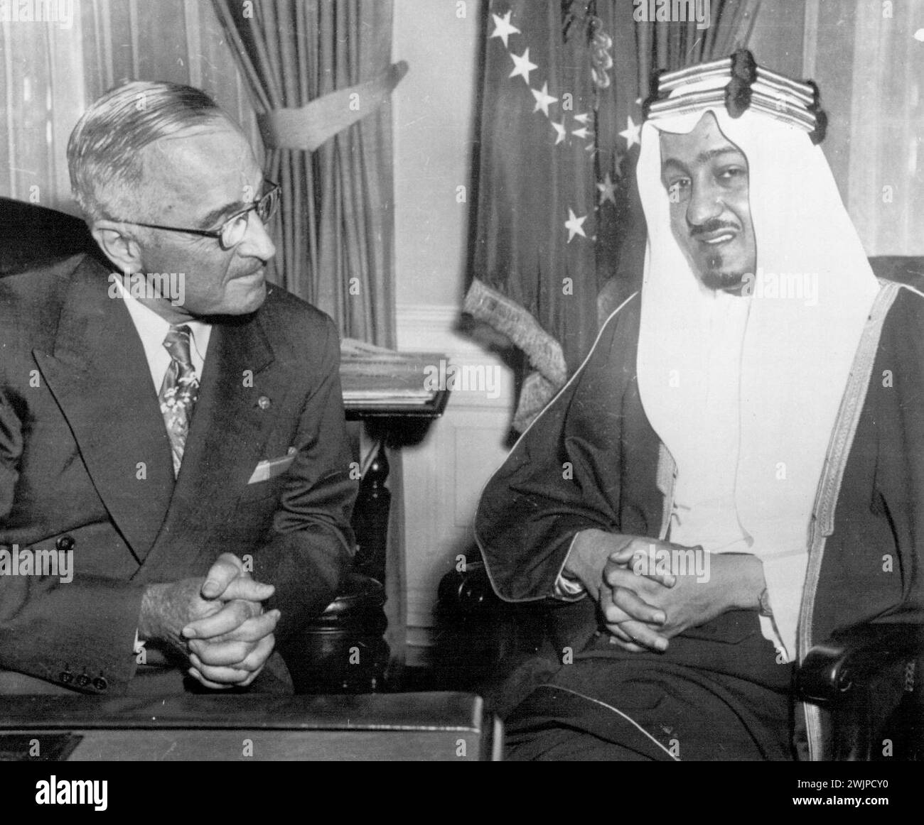 Arabian Prince Visits President -- Prince Abdullah Feisal, Minister of Interior and Public Health of Saudi Arabia talks with President Truman at the White House today. He is on a tour of the United States. August 18, 1952. (Photo by AP Wirephoto). Stock Photo