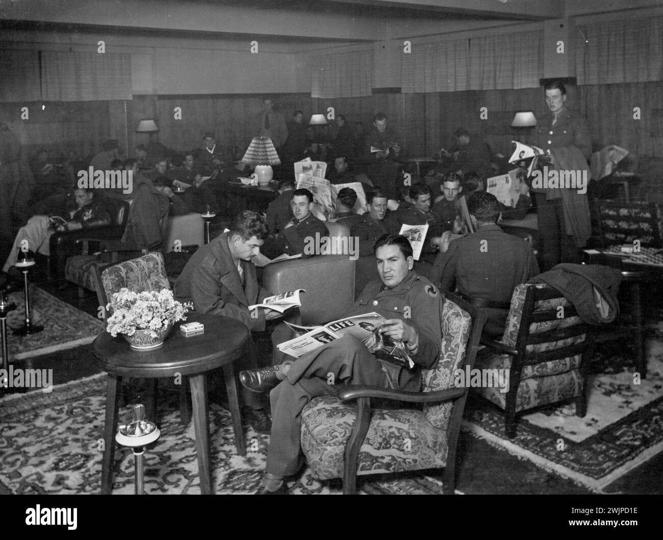 American Red Cross - Australia -- American Red Cross Service Club, Cr. Exhibition and Lt. Collins Sts., Melbourne - Section of Reading Room. August 6, 1942. (Photo by American Red Cross Photo). Stock Photo