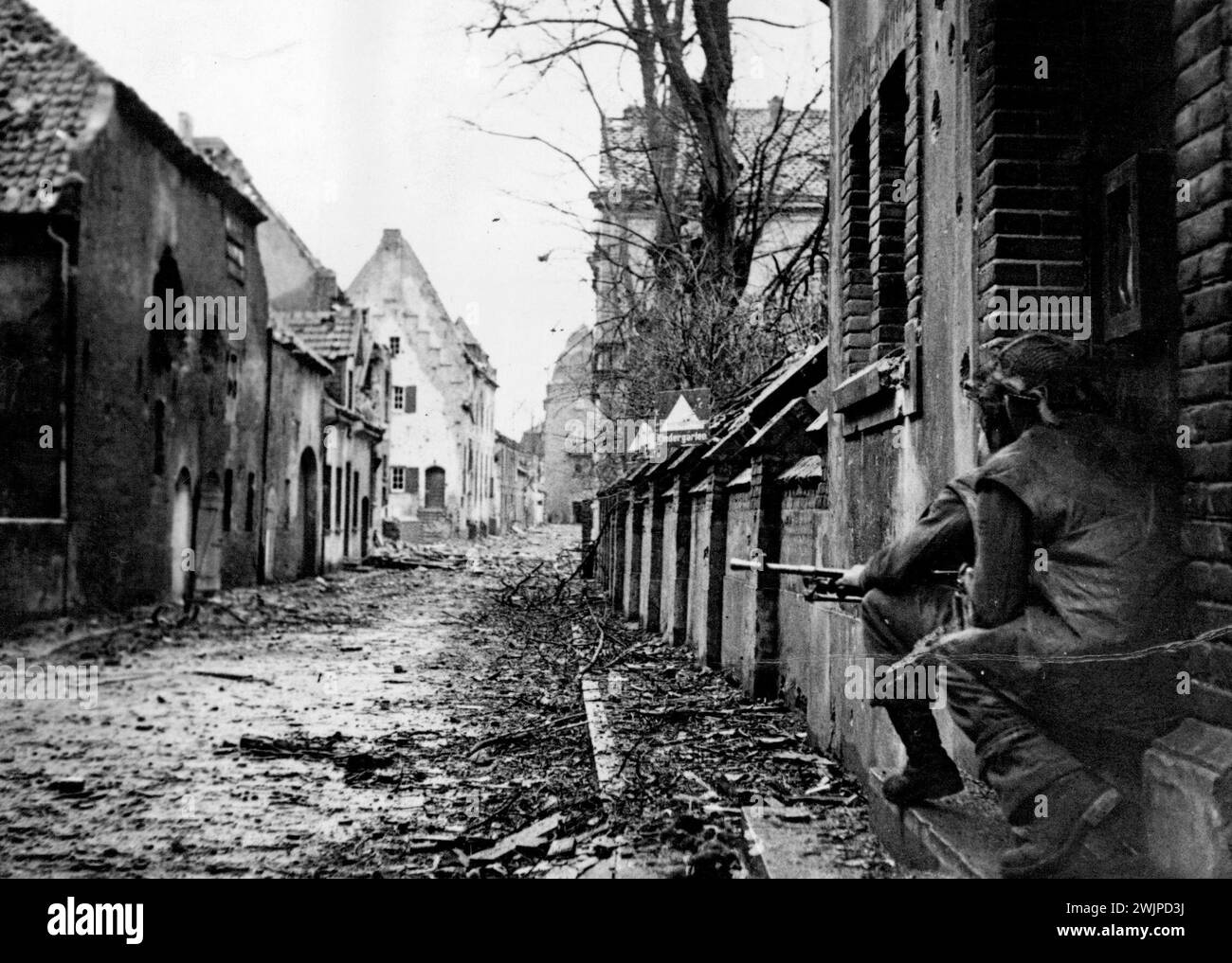 Infantry ***** out the ***** left in Nutterden. April 16, 1945. (Photo by British Official Photograph). Stock Photo