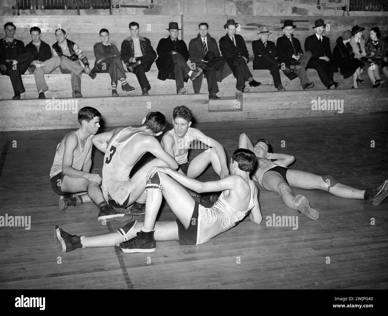 High School basketball players resting between periods, Eufaula, Oklahoma, USA, Russell Lee, U.S. Farm Security Administration, February 1940 Stock Photo