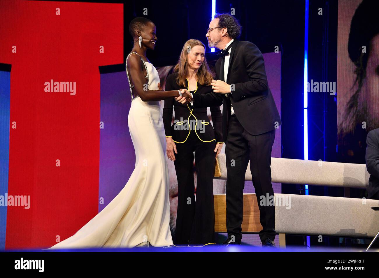 Lupita Nyong’o, Mariette Rissenbeek und Carlo Chatrian bei der Festivaleröffnung und der Premiere des Kinofilms 'Small Things Like These / Kleine Dinge wie diese' auf der Berlinale 2024 / 74. Internationale Filmfestspiele Berlin im Berlinale Palast. Berlin, 15.02.2024 Stock Photo