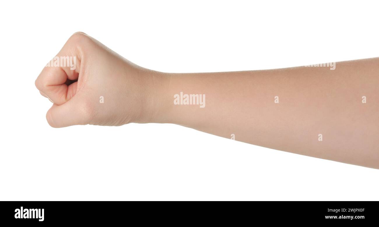 Playing rock, paper and scissors. Woman showing fist on white background, closeup Stock Photo