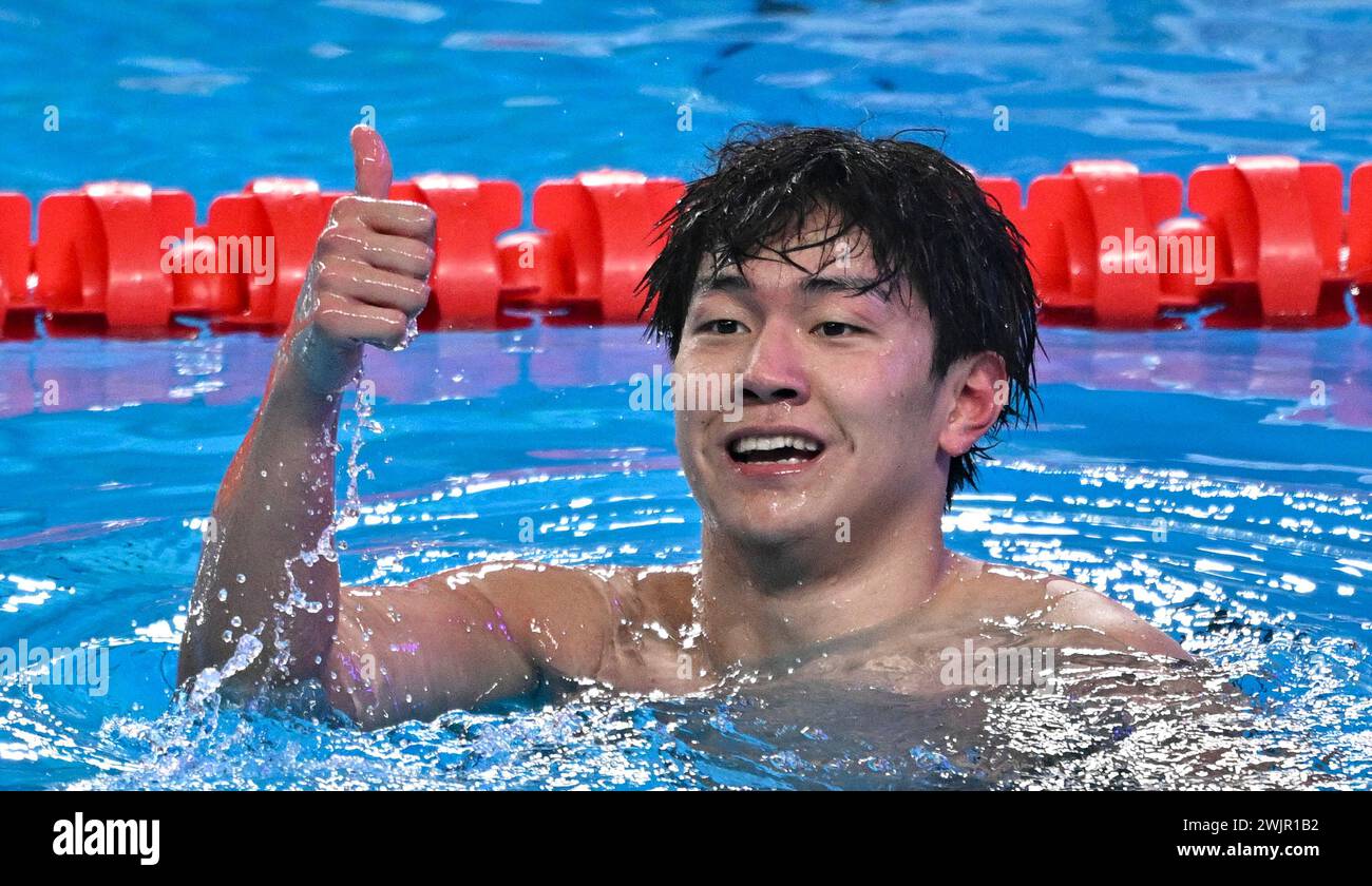 Doha, Qatar. 16th Feb, 2024. Dong Zhihao of China celebrates after