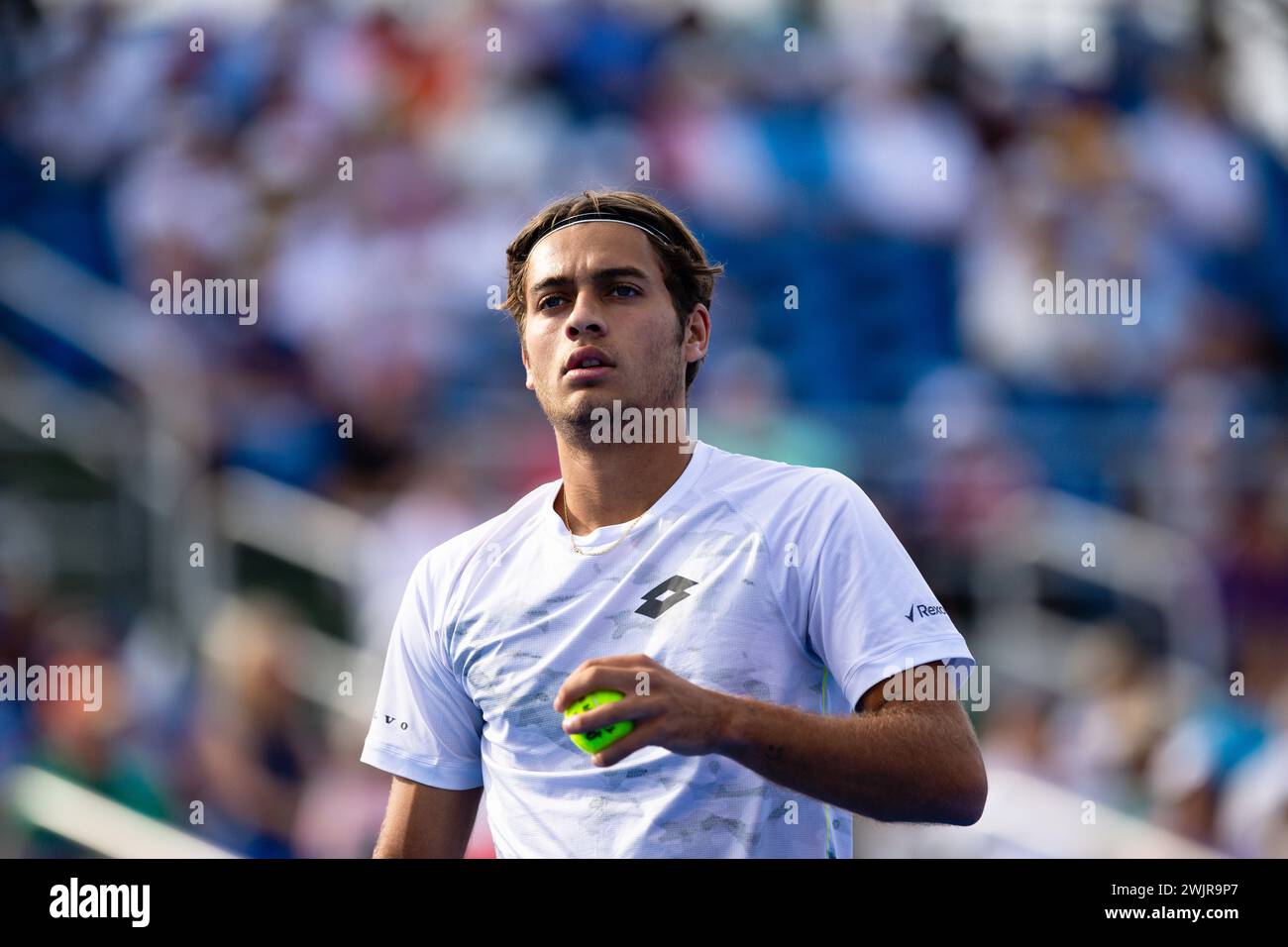 DELRAY BEACH, FL - FEBRUARY 16: Flavio Cobolli of Italy holds a tennis