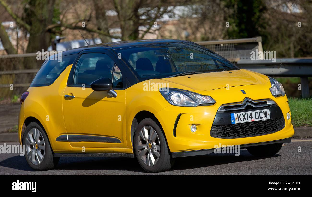 Milton Keynes,UK-Feb 16th 2024: 2014 yellow CITROEN DS3  car  driving on an English road Stock Photo