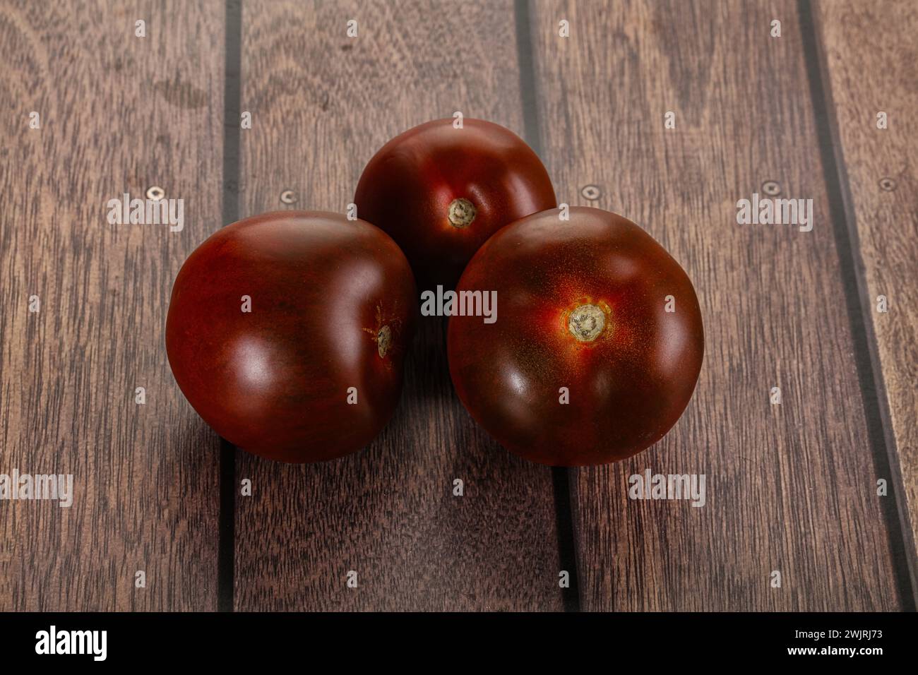 Organic natural juicy ripe Kumato tomato Stock Photo Alamy