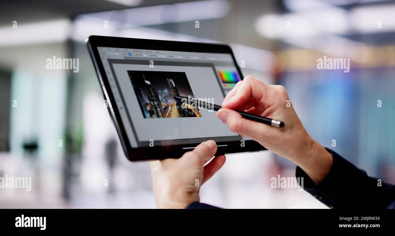Graphic Designer Woman Working On Tablet Computer Screen Stock Photo