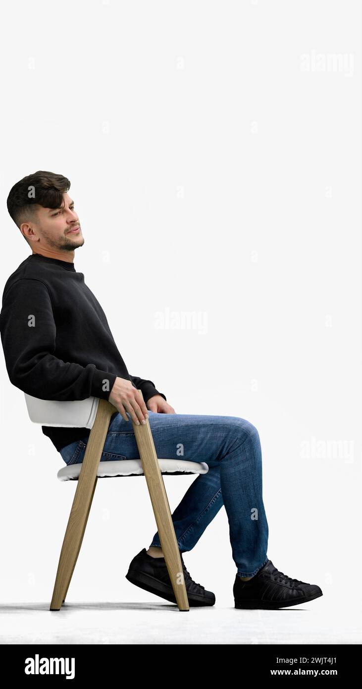 A man, on a white background, sitting on a chair Stock Photo