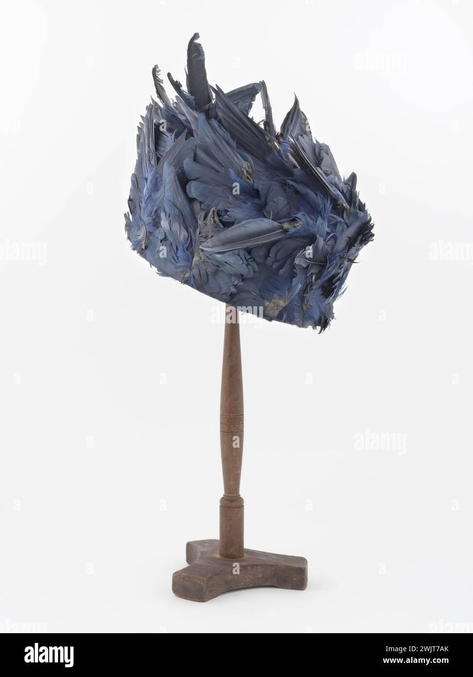 Madame Georgette, 1915, straw, covered with painted blue feathers, black velvet bias inside, black silk lining Palais Galliera, fashion museum of the city of Paris Stock Photo