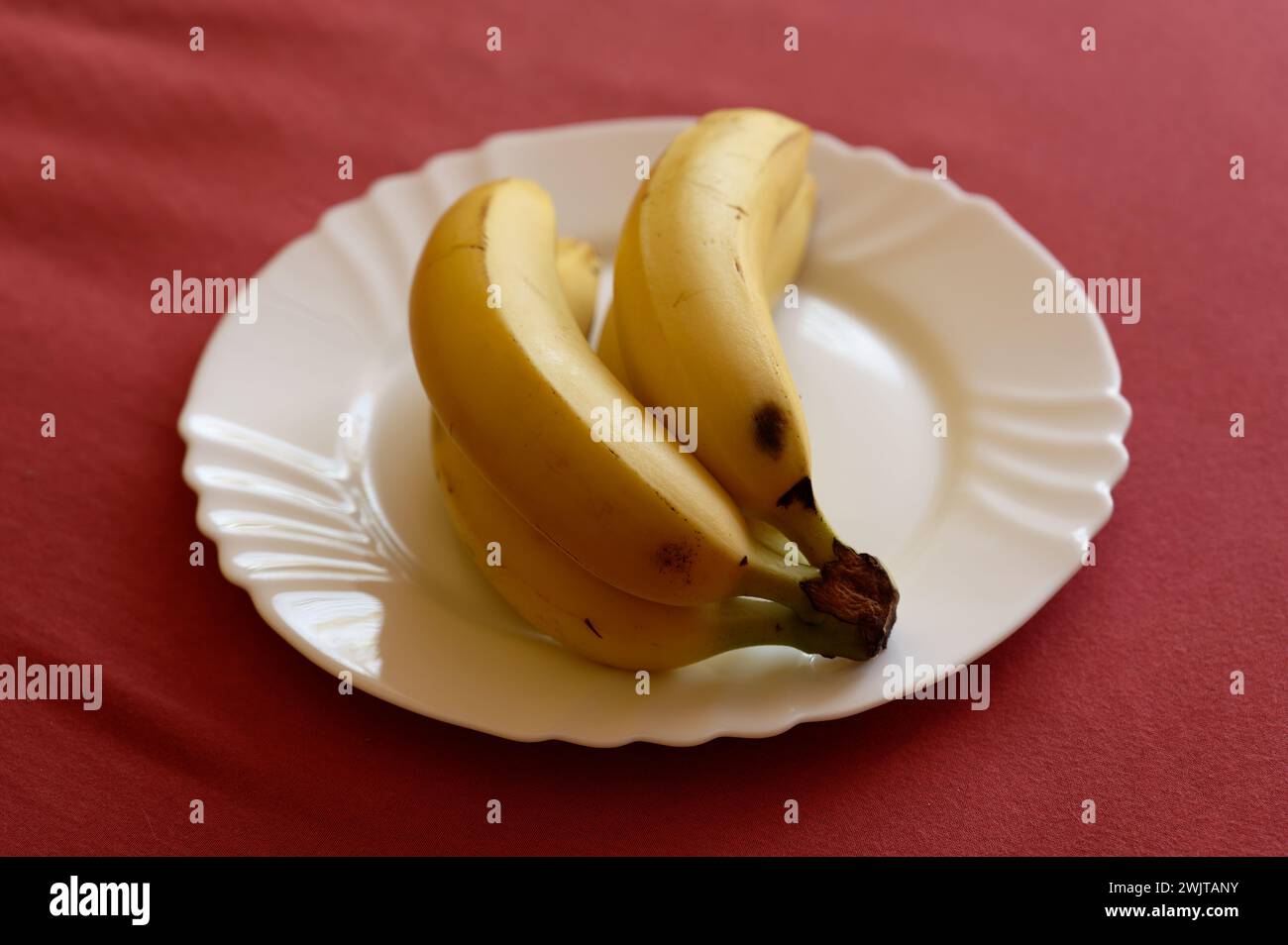 banana on white plate Stock Photo