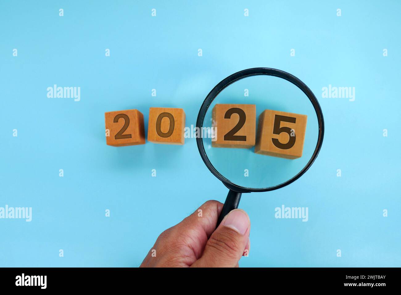 Magnifying glass and targets 2025. Concept of new year 2025, beginning