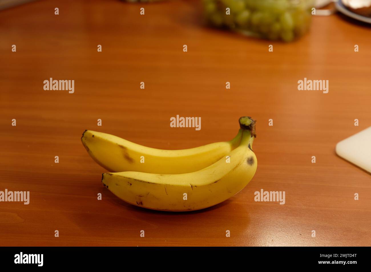 Beautiful fresh yellow banana on the table. Healthy food - fruit for a snack. Stock Photo